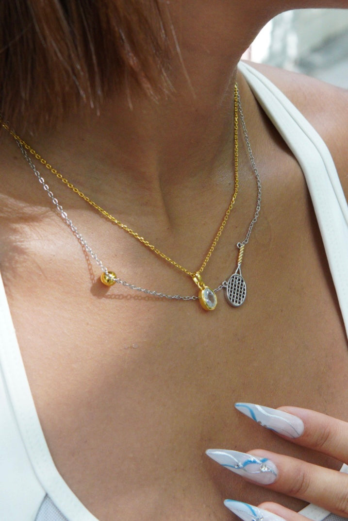 925 sterling-silver, gold-plated two-tone tennis-racket necklace – tennis jewelry in {{ product_color }} | Aura Tide Collective | Shop 925 sterling-silver, gold-plated two-tone tennis-racket necklace online for {{ product_tags | join: ", " }} – Fast shipping worldwide.