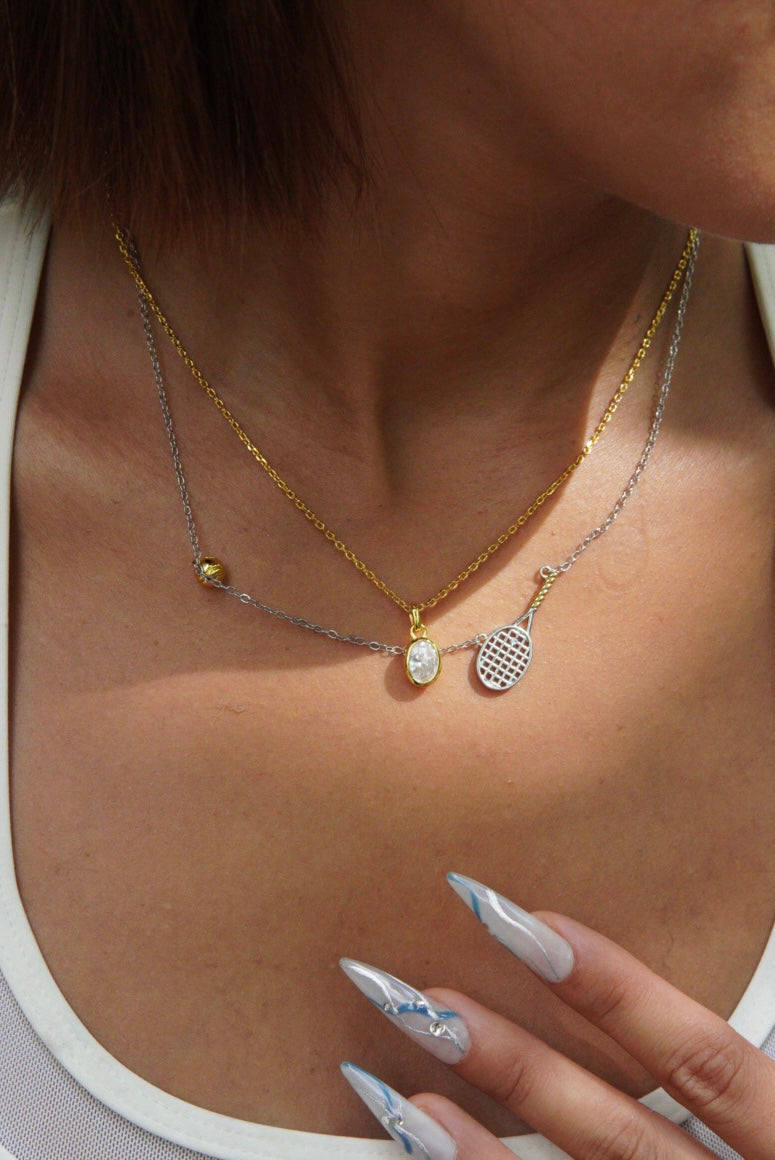 925 sterling-silver, gold-plated two-tone tennis-racket necklace – tennis jewelry in {{ product_color }} | Aura Tide Collective | Shop 925 sterling-silver, gold-plated two-tone tennis-racket necklace online for {{ product_tags | join: ", " }} – Fast shipping worldwide.