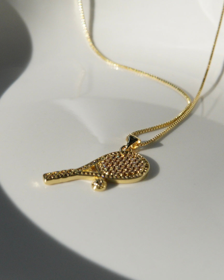 18K real gold-plated copper tennis-racket necklace paved with zircon – tennis jewelry in {{ product_color }} | Aura Tide Collective | Shop 18K real gold-plated copper tennis-racket necklace paved with zircon online for {{ product_tags | join: ", " }} – Fast shipping worldwide.