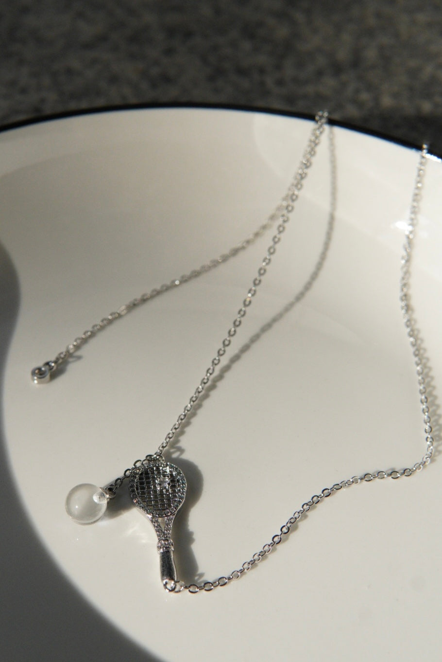 Old-money brushed-finish tennis-racket crystal-ball necklace & bracelet – tennis jewelry in {{ product_color }} | Aura Tide Collective | Shop Old-money brushed-finish tennis-racket crystal-ball necklace & bracelet online for {{ product_tags | join: ", " }} – Fast shipping worldwide.