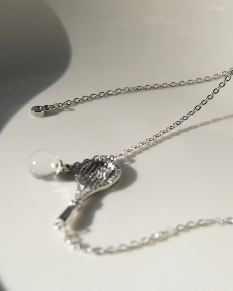 Old-money brushed-finish tennis-racket crystal-ball necklace & bracelet – tennis jewelry in {{ product_color }} | Aura Tide Collective | Shop Old-money brushed-finish tennis-racket crystal-ball necklace & bracelet online for {{ product_tags | join: ", " }} – Fast shipping worldwide.
