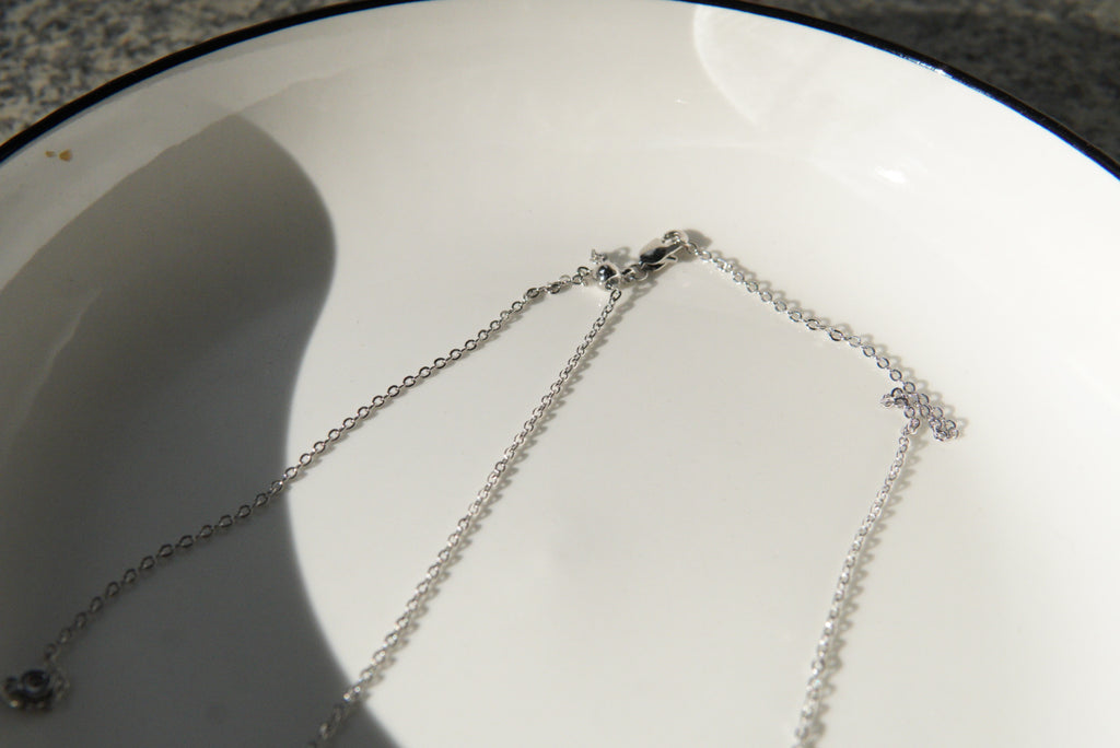 Old-money brushed-finish tennis-racket crystal-ball necklace & bracelet – tennis jewelry in {{ product_color }} | Aura Tide Collective | Shop Old-money brushed-finish tennis-racket crystal-ball necklace & bracelet online for {{ product_tags | join: ", " }} – Fast shipping worldwide.