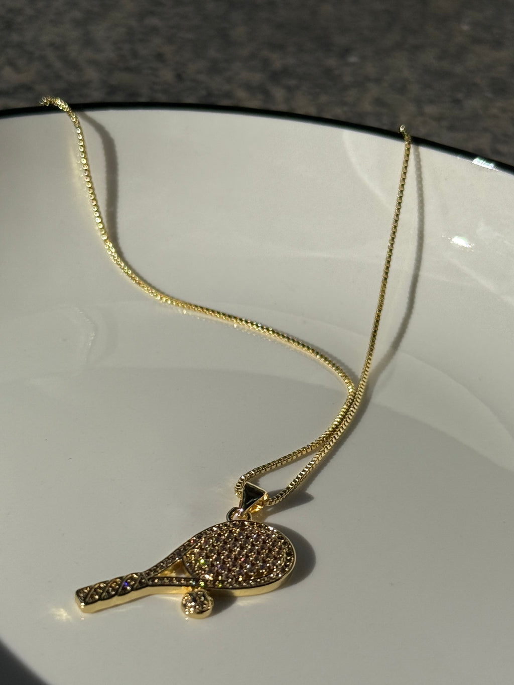 18K real gold-plated copper tennis-racket necklace paved with zircon – tennis jewelry in {{ product_color }} | Aura Tide Collective | Shop 18K real gold-plated copper tennis-racket necklace paved with zircon online for {{ product_tags | join: ", " }} – Fast shipping worldwide.