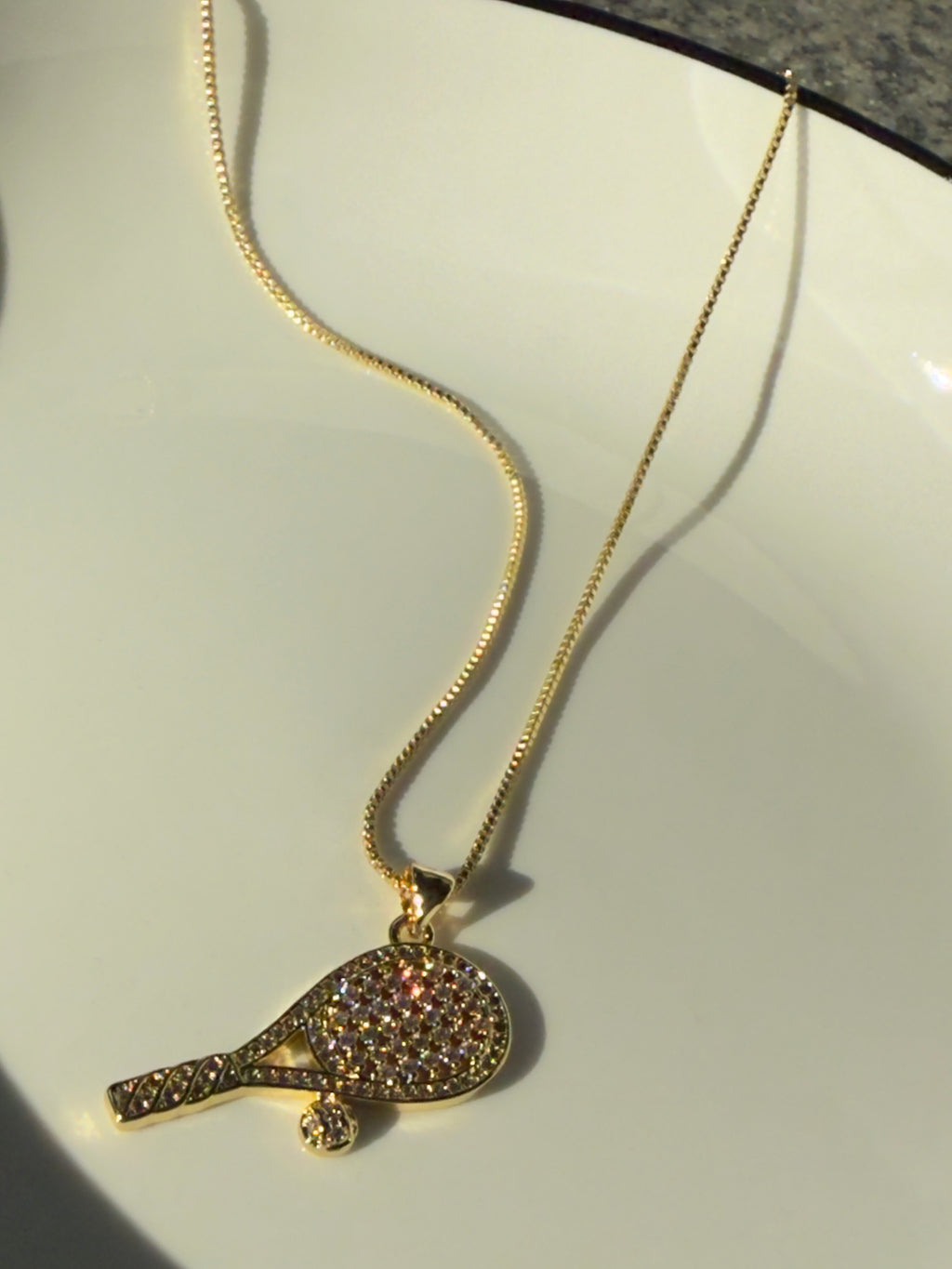 18K real gold-plated copper tennis-racket necklace paved with zircon – tennis jewelry in {{ product_color }} | Aura Tide Collective | Shop 18K real gold-plated copper tennis-racket necklace paved with zircon online for {{ product_tags | join: ", " }} – Fast shipping worldwide.