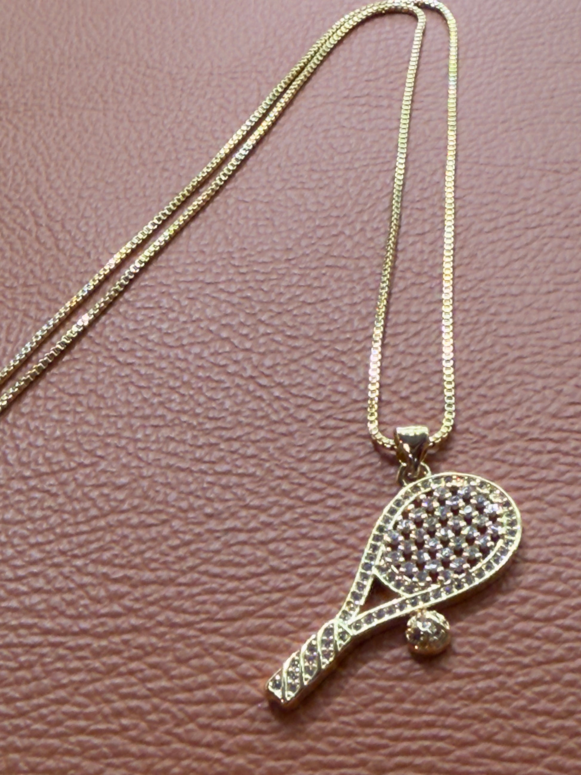 18K real gold-plated copper tennis-racket necklace paved with zircon – tennis jewelry in {{ product_color }} | Aura Tide Collective | Shop 18K real gold-plated copper tennis-racket necklace paved with zircon online for {{ product_tags | join: ", " }} – Fast shipping worldwide.