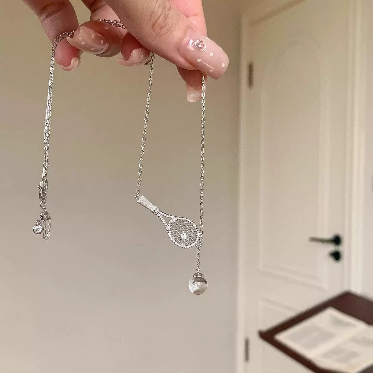Old-money brushed-finish tennis-racket crystal-ball necklace & bracelet – tennis jewelry in {{ product_color }} | Aura Tide Collective | Shop Old-money brushed-finish tennis-racket crystal-ball necklace & bracelet online for {{ product_tags | join: ", " }} – Fast shipping worldwide.
