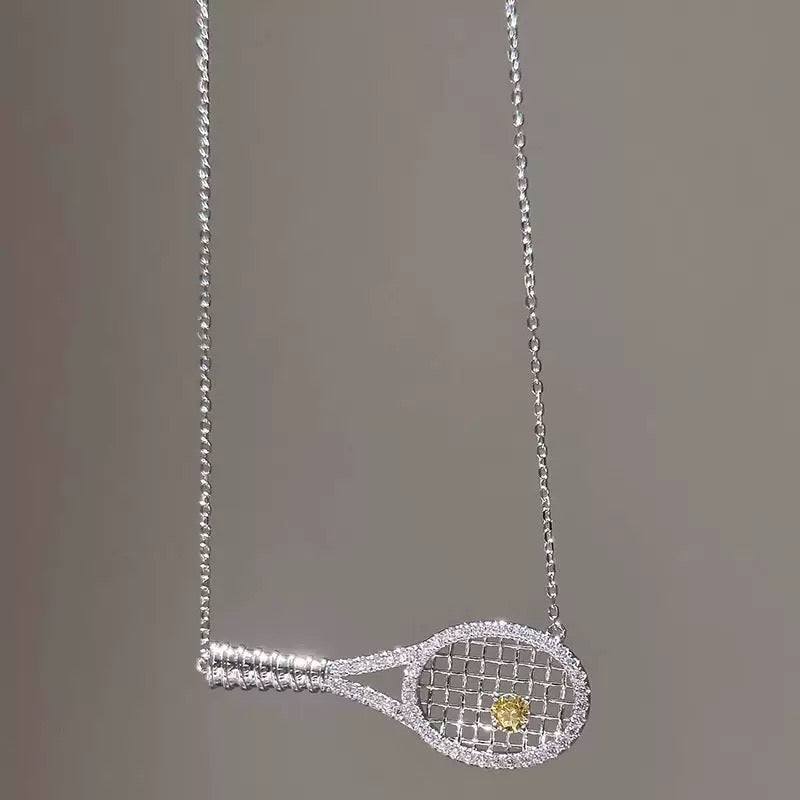 Old-money color-diamond tennis-racket necklace – tennis jewelry in {{ product_color }} | Aura Tide Collective | Shop Old-money color-diamond tennis-racket necklace online for {{ product_tags | join: ", " }} – Fast shipping worldwide.