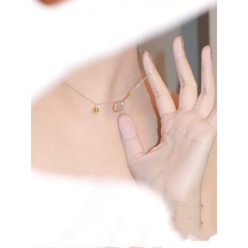 925 sterling-silver, gold-plated two-tone tennis-racket necklace – tennis jewelry in {{ product_color }} | Aura Tide Collective | Shop 925 sterling-silver, gold-plated two-tone tennis-racket necklace online for {{ product_tags | join: ", " }} – Fast shipping worldwide.