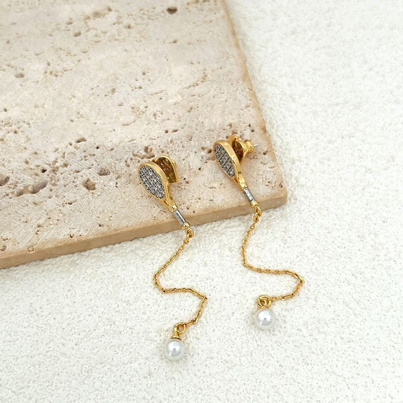 Unique tennis racket collarbone chain earrings – tennis jewelry in {{ product_color }} | Aura Tide Collective | Shop Unique tennis racket collarbone chain earrings online for {{ product_tags | join: ", " }} – Fast shipping worldwide.