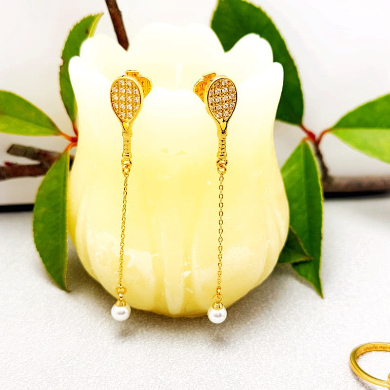 Unique tennis racket collarbone chain earrings – tennis jewelry in {{ product_color }} | Aura Tide Collective | Shop Unique tennis racket collarbone chain earrings online for {{ product_tags | join: ", " }} – Fast shipping worldwide.