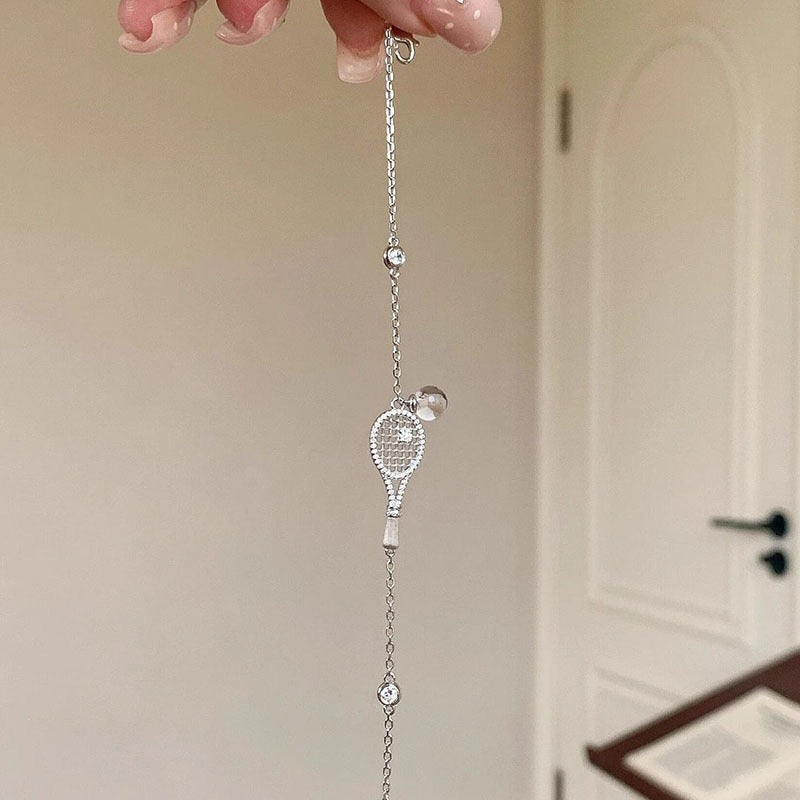 Old-money brushed-finish tennis-racket crystal-ball necklace & bracelet – tennis jewelry in {{ product_color }} | Aura Tide Collective | Shop Old-money brushed-finish tennis-racket crystal-ball necklace & bracelet online for {{ product_tags | join: ", " }} – Fast shipping worldwide.