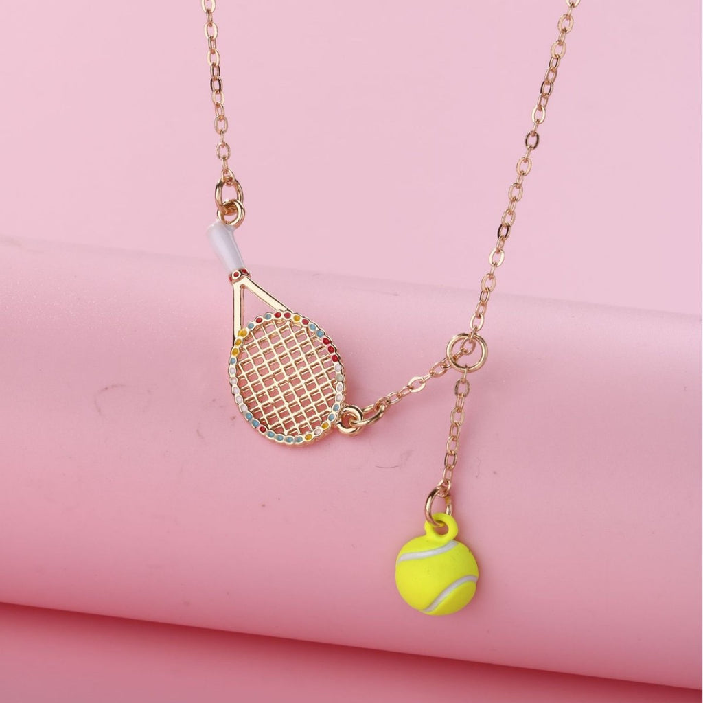 Kids Tennis racquet and tennis ball necklace – tennis jewelry in {{ product_color }} | Aura Tide Collective | Shop Kids Tennis racquet and tennis ball necklace online for {{ product_tags | join: ", " }} – Fast shipping worldwide.