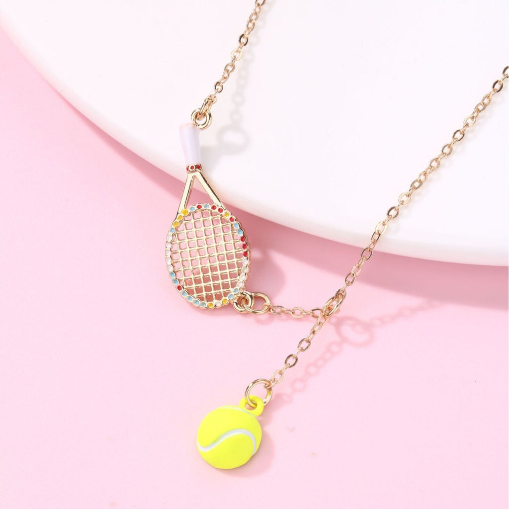 Kids Tennis racquet and tennis ball necklace – tennis jewelry in {{ product_color }} | Aura Tide Collective | Shop Kids Tennis racquet and tennis ball necklace online for {{ product_tags | join: ", " }} – Fast shipping worldwide.