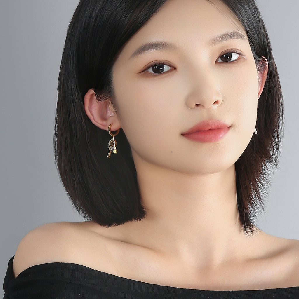 Aura flow tennis racquet earrings ear hoops – tennis jewelry in {{ product_color }} | Aura Tide Collective | Shop Aura flow tennis racquet earrings ear hoops online for {{ product_tags | join: ", " }} – Fast shipping worldwide.